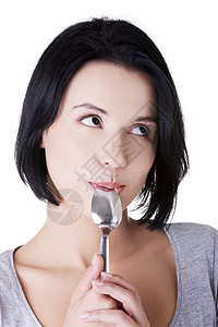 女人嘴里有勺子成人工具诱惑饮食食欲喜悦快乐女孩女性微笑图片