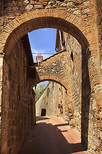 圣金米尼纳诺托斯卡尼意大利中世纪镇假期纪念碑街道历史城堡乡村石头旅行拱门历史性图片