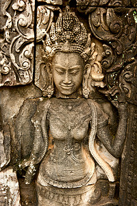 在拜隆寺上微笑着的面目上帝文化蓝色砂岩石头宗教雕刻建筑纪念碑旅行图片