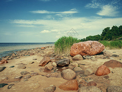 海边岩石海滩太阳海岸线海岸石头假期旅游多云巨石地平线风景背景图片