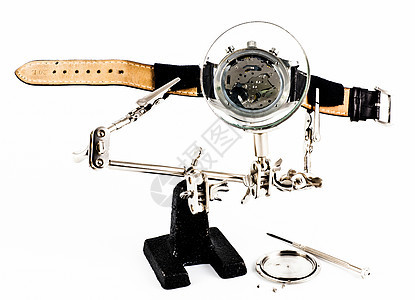观察修理作业职业把手镜片时间工艺技术钟表齿轮小时乐器背景图片
