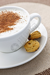 卡布奇诺咖啡或拿铁咖啡粉状牛奶咖啡起泡可可棕色饼干泡沫褐色食物图片