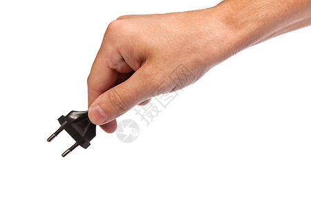 人手里握着一个黑门口插头男性手指塑料金属电气绳索插座技术力量图片