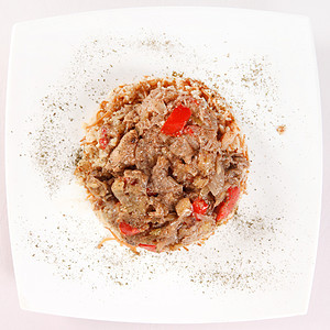 大米Wiiht肉类和蔬菜食物洋葱盘子油炸胡椒美食猪肉辣椒香料午餐图片