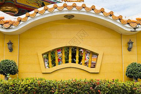中国神庙的混凝土墙壁锥度雕塑橙子庇护所寺庙石板佛教徒建筑屋檐瓷砖图片