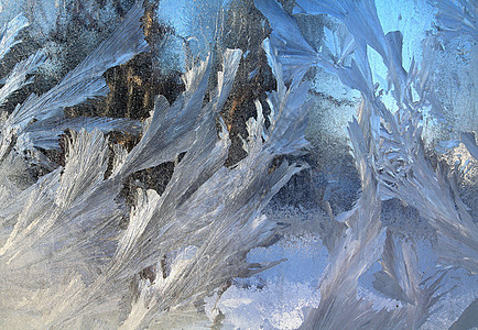 窗口上的冰结晶棕色冻结温度气候雪花寒冷窗户玻璃蓝色图片