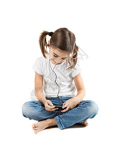 听音乐童年白色孩子享受技术音乐播放器手机娱乐幸福女孩图片
