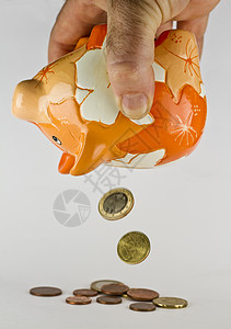 存着落下来的硬币的小猪银行图片
