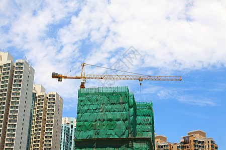 建筑工地工程建造格子对角线脚手架网络商业城市水泥起重机图片