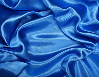 平滑优雅的蓝色丝绸作为背景材料折痕曲线天蓝色布料纺织品织物投标银色海浪图片