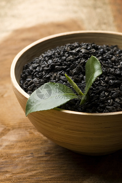 清茶和干茶草本叶子草本植物白毫享受黑色药品绿色木头文化图片