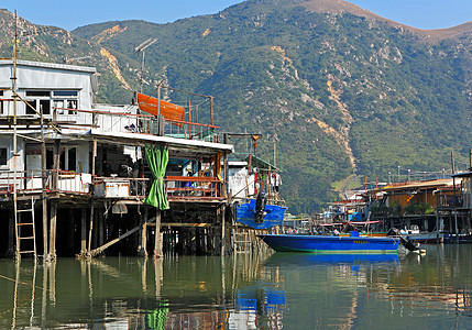 香港Tai O渔业村旅行房子住宅村庄风化棚户区钓鱼场景天空蓝色图片
