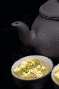 中国茉菊茶壶和杯子植物花瓣茉莉草本植物叶子茉莉花输液图片