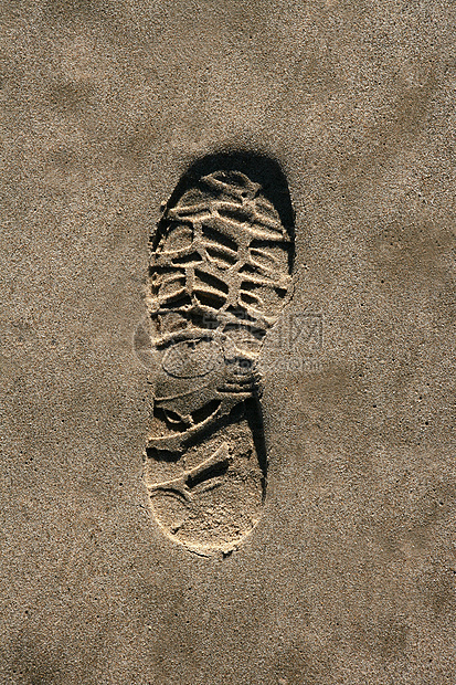 海滩棕色沙质印刷纸上的脚鞋鞋印海滨男人支撑脚步打印脚印旅行沙丘阴影图片