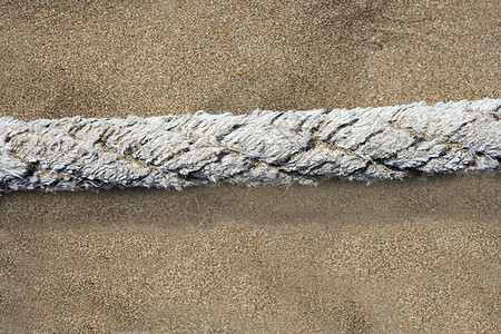 沙滩沙滩上古老的海洋绳索背景图片