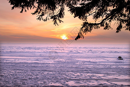 美丽的冬季日落蓝色海洋海岸海岸线海滩支撑天空冷冻阳光太阳图片