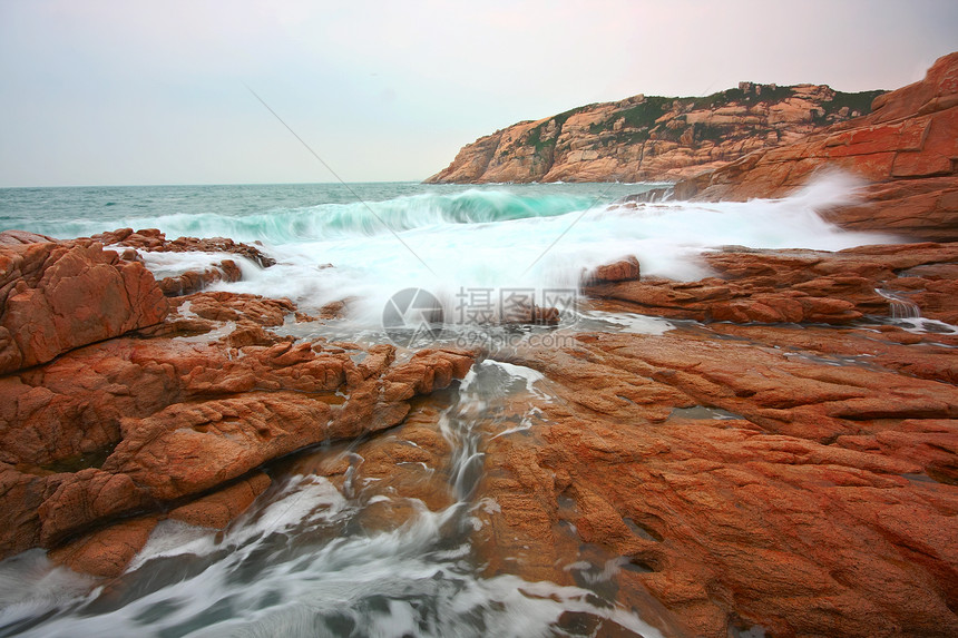 岩石海岸和深水中模糊的水 香港旅游金子蓝色风景旅行太阳热带日落季节天空图片