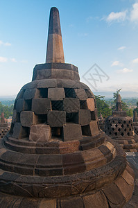 印度尼西亚中爪哇博罗布杜尔寺寺庙日出面孔艺术文化雕塑石头崇拜建筑学遗迹图片