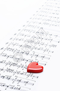 我爱音乐 带心的乐谱文化文档红色艺术唱歌风格宏观音符条纹符号图片