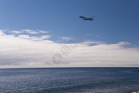 马 提拉天空飞机场旅行航班海洋飞行飞机背景图片