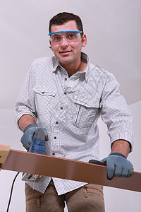男人切地板手套安装木匠眼镜工具木头工人建设者安全风镜图片