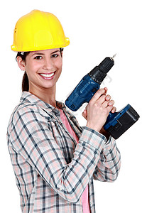 从事钻井的女性建筑工人;图片