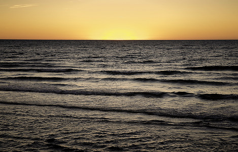 海洋日落橙子太阳海岸旅行日出天空海滩背景图片