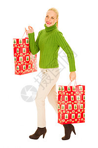 带着带圣诞礼物袋的女人微笑礼物女士购物金发购物袋女子金发女郎成人头发图片