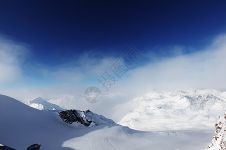 平面顶部滑雪太阳顶峰冰川运动蓝色风景远足爬坡全景图片