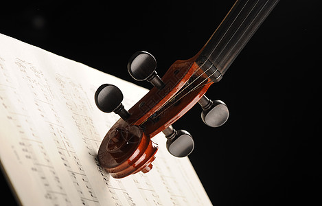 乐谱上小提琴最优美的一拍交响乐团风格木头乐器音乐会演艺红色音乐活动图片