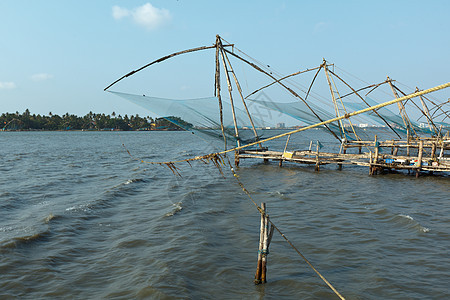 日落时中国鱼网 印度喀拉拉邦科奇绳索支撑渔网地平线高知钓鱼图片