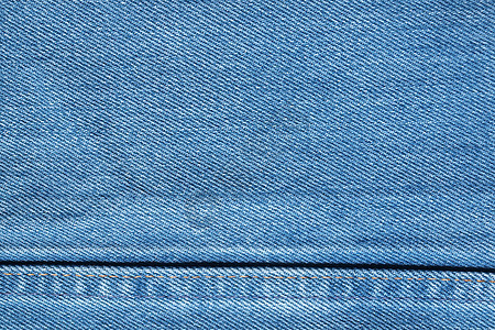 蓝色牛仔裤纹理 背景牛仔布裤子服饰服装接缝白色织物标签材料宏观图片
