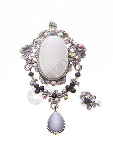 在背景上有着不同宝石的胸针蓝色吊坠钻石水晶奢华魅力叶子项链古董水钻图片