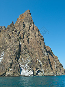 火山旅行巨石海岸石头旅游海洋反射天空风景爬坡图片