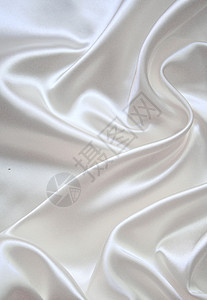 平滑优雅的白色丝绸折痕纺织品涟漪布料曲线投标新娘织物婚礼银色图片