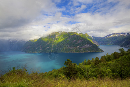 云水瑶土楼Geiranger 视图石头悬崖海岸天空山坡植物群国家峡湾蓝色反射背景