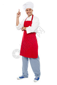 年轻聪明的厨师指着食指向上食谱男性快乐工作厨房烹饪商业手指餐饮食物图片