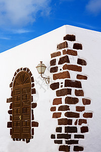 加那利群岛的白人村庄城市建筑学粉饰窗户火山天空干旱房屋石头街道图片