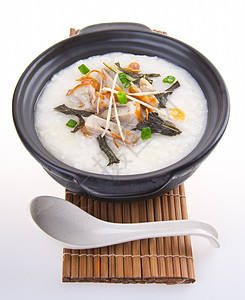 传统中国猪肉粥炒饭 在粘土锅中使用稀饭蔬菜食物草药早餐午餐猪肉文化水平谷物图片