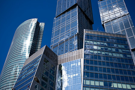 摩天大楼市中心晴天公司反射窗户城市建筑学玻璃中心财产图片