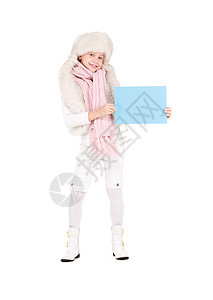 身戴冬帽 带空白板的女孩围巾孩子海报推介会帽子广告微笑蓝色女性棉被图片