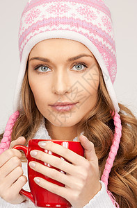 红脸的美女头发杯子成人帽子女性女孩饮料季节福利图片