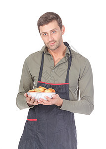 男人在烘烤时尝试他的手糕点美食蛋糕餐饮男性服务食物糖果厨房饮食图片