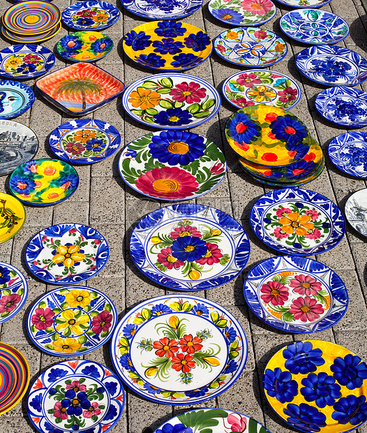 来自地中海西班牙的陶瓷精神纪念品太阳旅游陶器盘子假期地面店铺工匠图片