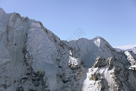 雪雪山顶峰岩石爬坡山峰冰川环境全景远足蓝色天空图片