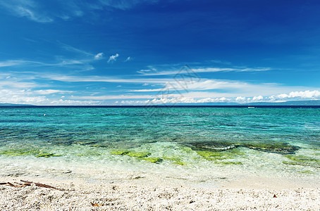 美丽的海滩边缘旅行海岸线荒野热带海浪天空海景风景地平线图片