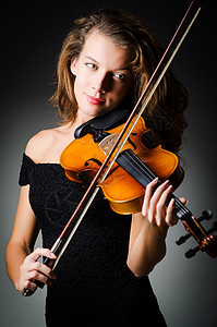 在暗房里拉小提琴的女人细绳手指演奏家演员木头小提琴家作品艺术家提琴手旋律图片