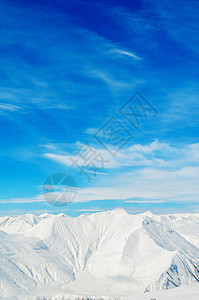 明亮的冬天天雪山白色旅行天空假期阳光冰川滑雪山脉风景场景图片