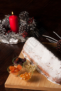 斯托层干果烛光蜡烛诞蛋糕葡萄干粉状装饰蛋糕水平背景图片