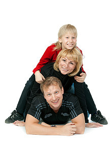 幸福的家庭躺在地上乐趣女士母亲喜悦工作室儿子丈夫男性男生白色图片